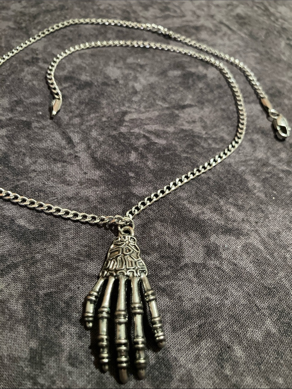 Silver-Tone Skeletal Hand Pendant Necklace